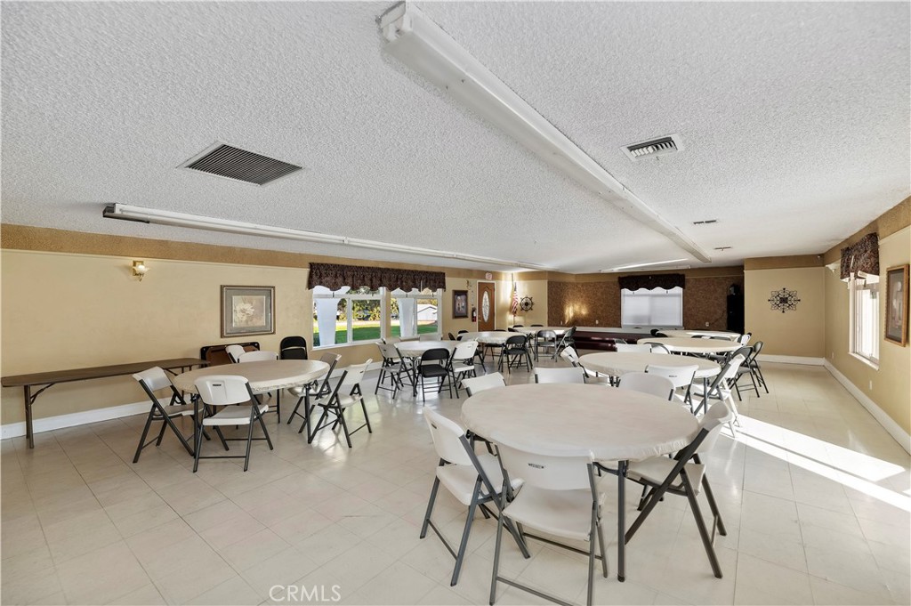 32600 State Highway 74, Unit 140 Hemet, CA 92545 - Photo 29 of 30 a view of a dining room with furniture and a livingroom