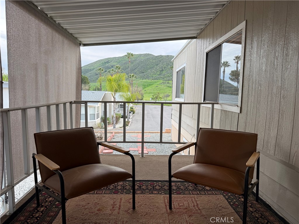 32600 State Highway 74, Unit 140 Hemet, CA 92545 - Photo 4 of 30 a balcony view with a couch