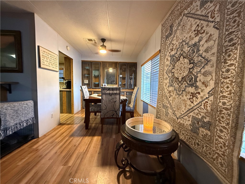 32600 State Highway 74, Unit 140 Hemet, CA 92545 - Photo 7 of 30 a living room with furniture and a fireplace