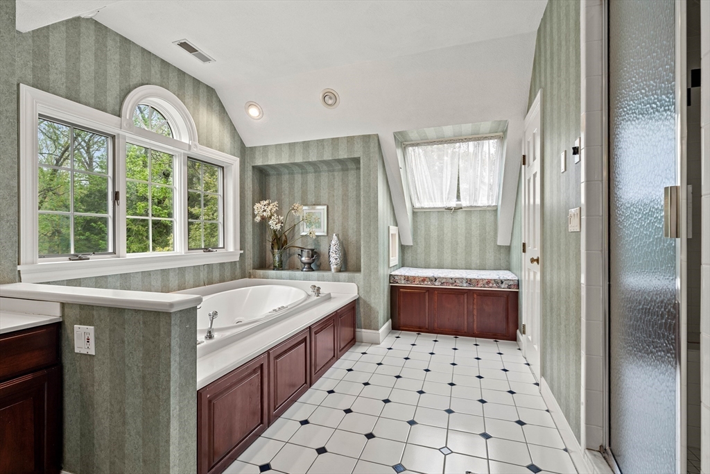 37 Old Planters Road Beverly, MA 01915 - Photo 27 of 42 a bathroom with a sink a bathtub a window and a shower