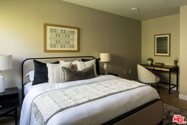 a bedroom with a bed and a table in it