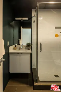 a bathroom with a sink and mirror