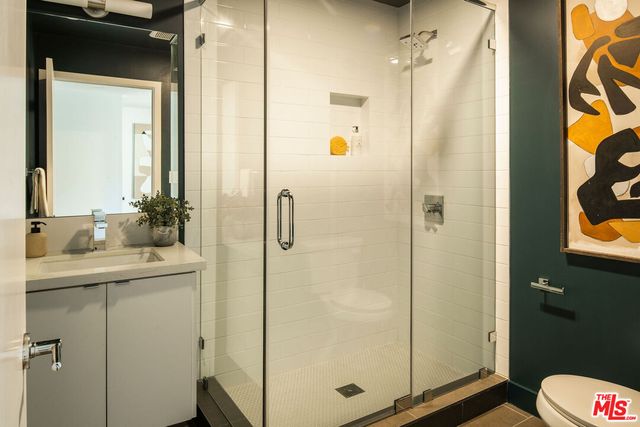 a bathroom with a shower and a sink