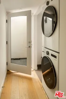 a view of a hallway with washer and dryer