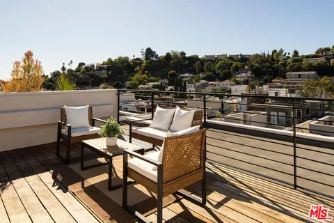 a view of a terrace with seating area