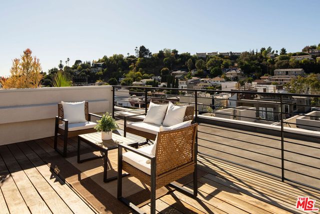 a view of a terrace with seating area