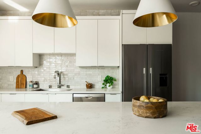 a kitchen with a sink and a stove