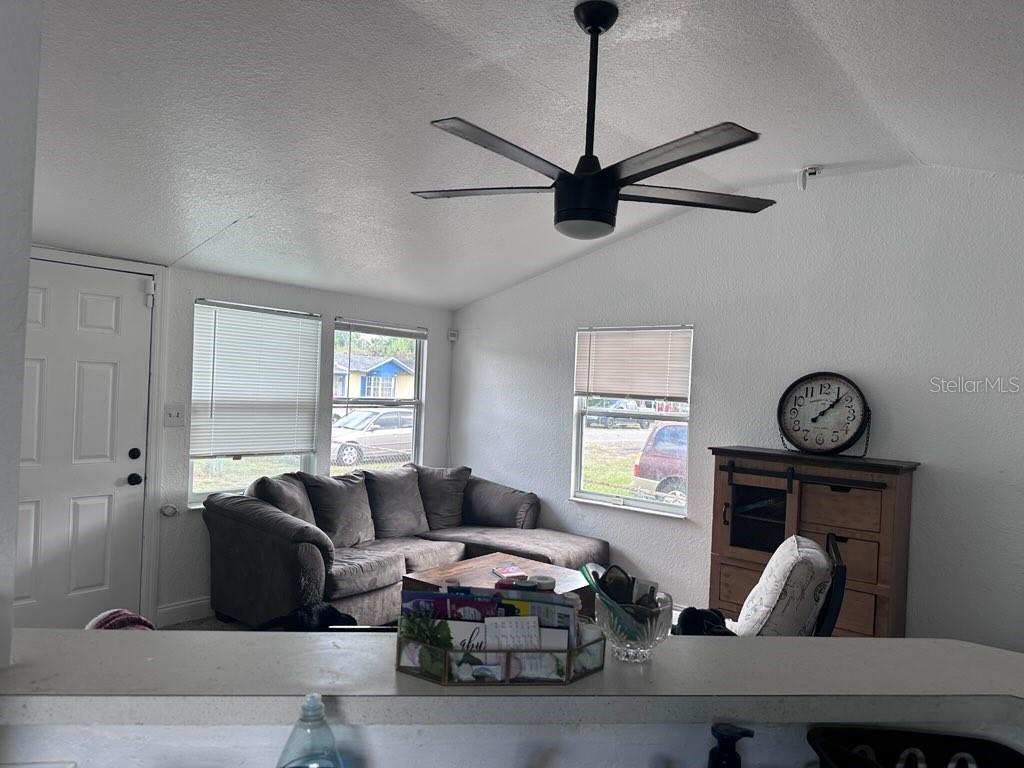 10030 Ingram Avenue Ocoee, FL 34761 - Photo 11 of 16 a living room with furniture a window and a window