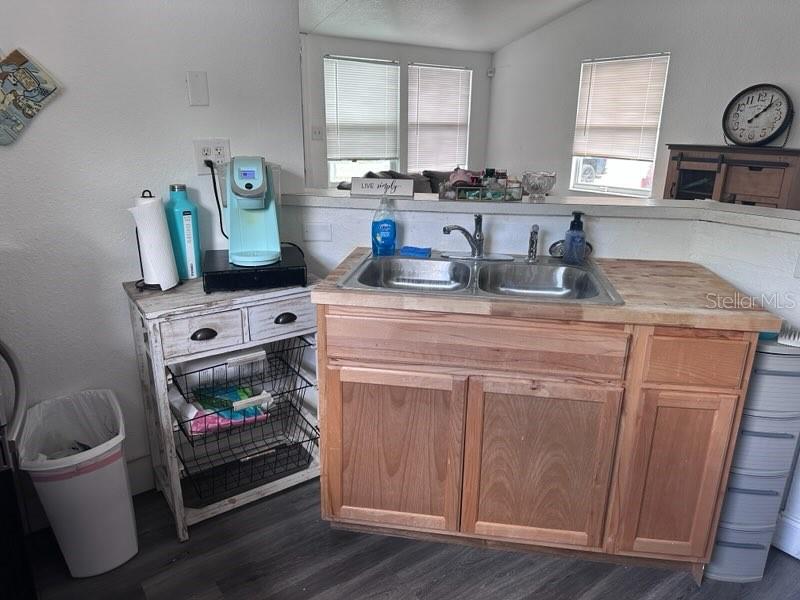 10030 Ingram Avenue Ocoee, FL 34761 - Photo 13 of 16 a kitchen with a stove and white cabinets