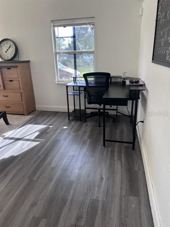 10030 Ingram Avenue Ocoee, FL 34761 - Photo 14 of 16 a workspace with wooden floor