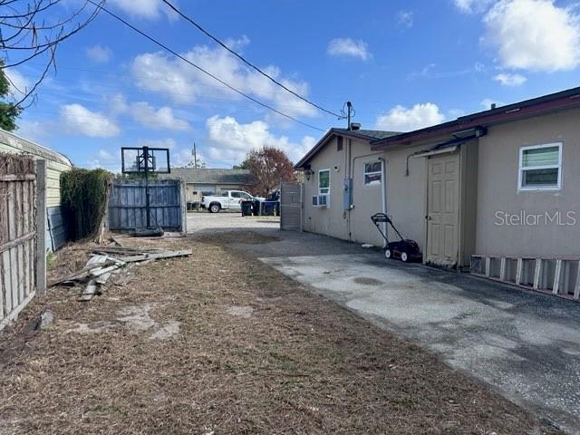 10030 Ingram Avenue Ocoee, FL 34761 - Photo 3 of 16 a view of a house with a yard