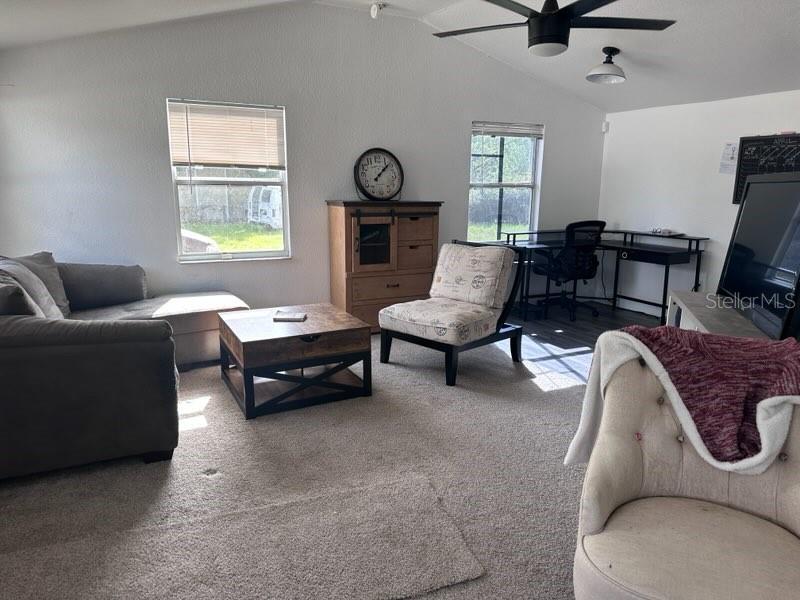 10030 Ingram Avenue Ocoee, FL 34761 - Photo 9 of 16 a living room with furniture and a window