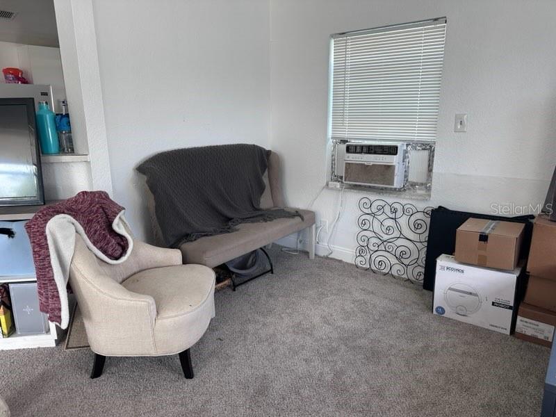 10030 Ingram Avenue Ocoee, FL 34761 - Photo 10 of 16 a living room with furniture and a fireplace