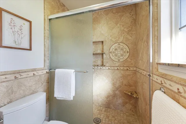 a bathroom with a shower and a sink