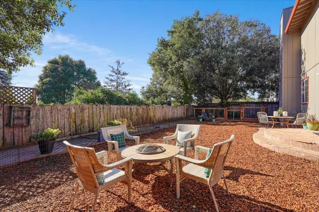 a view of a backyard with furniture