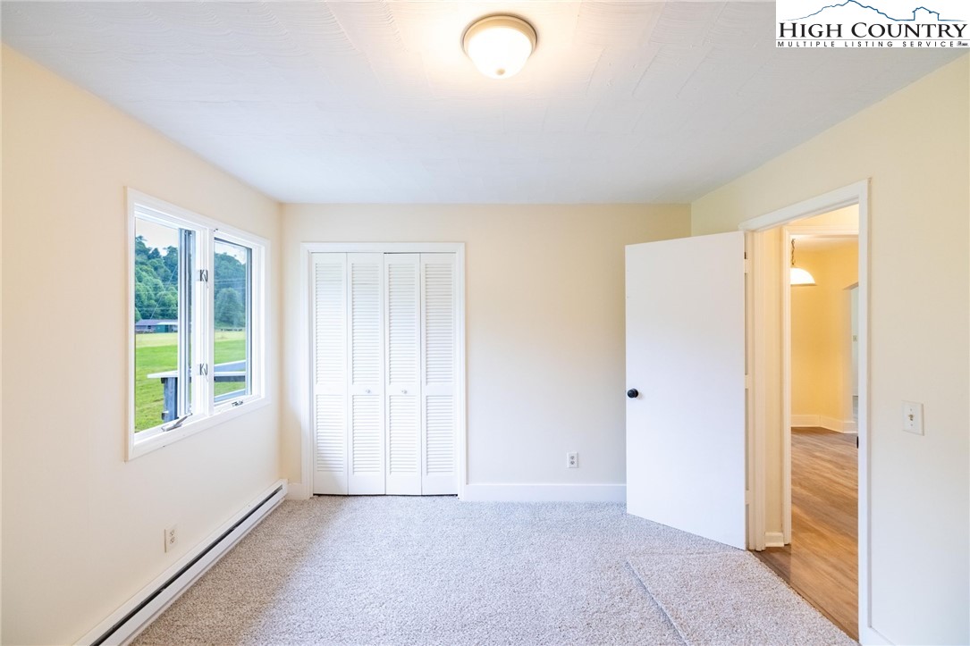 898 3 Top Road Creston, NC 28615 - Photo 16 of 48 a view of an empty room with window and closet