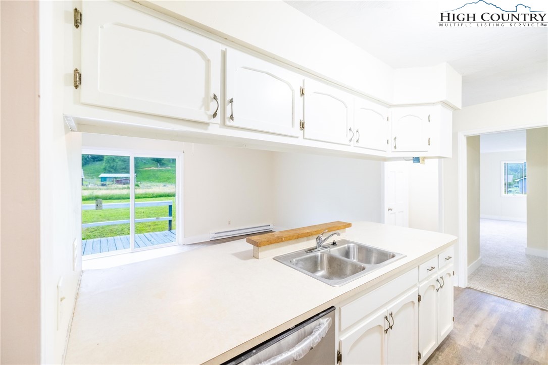 898 3 Top Road Creston, NC 28615 - Photo 20 of 48 a kitchen with a sink cabinets and a window