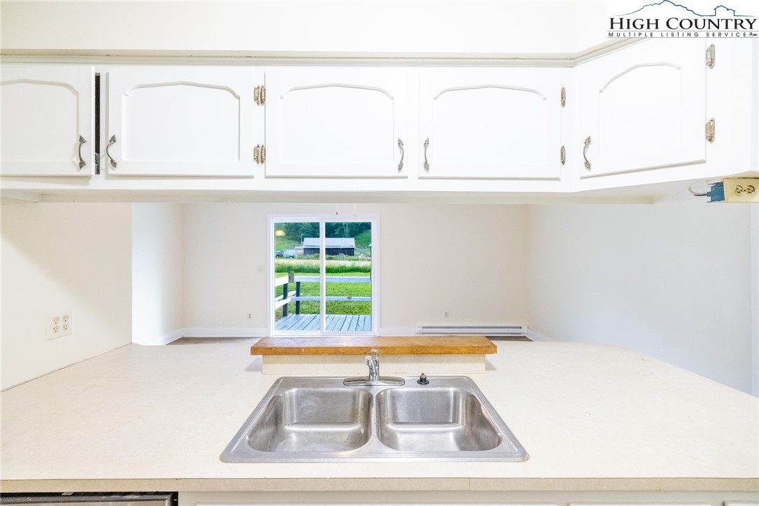 898 3 Top Road Creston, NC 28615 - Photo 21 of 48 a view of a kitchen with a sink and dishwasher
