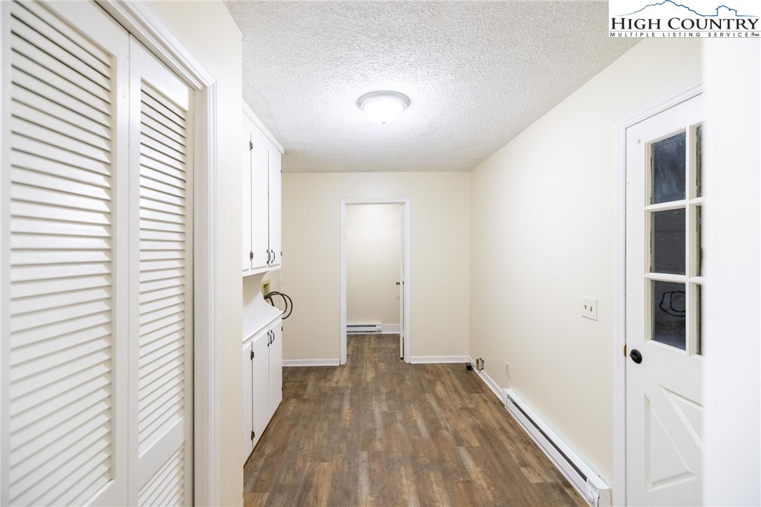 898 3 Top Road Creston, NC 28615 - Photo 32 of 48 a view of a hallway with wooden floor and staircase