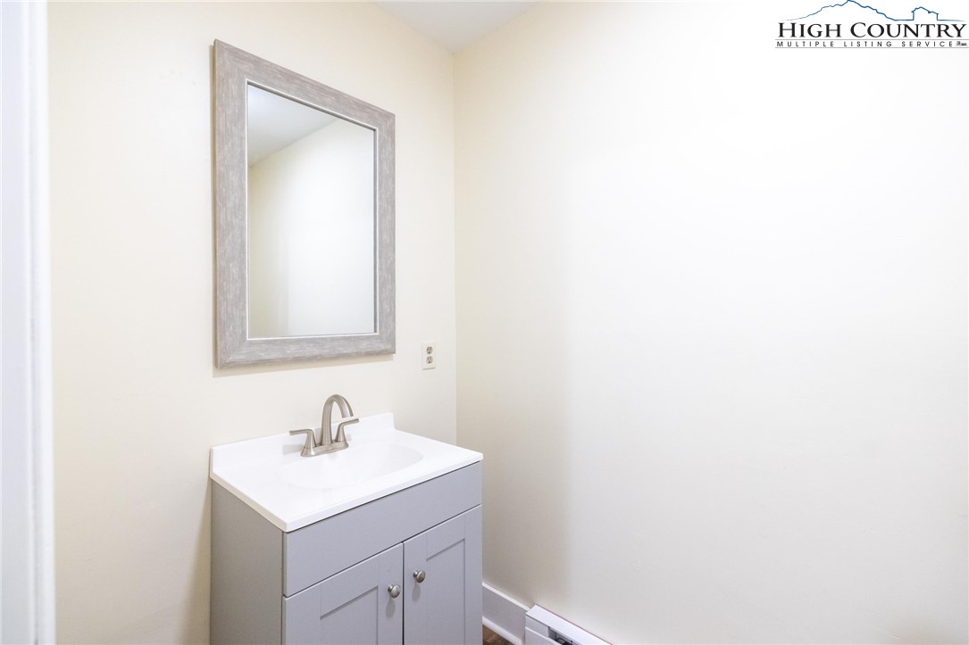 898 3 Top Road Creston, NC 28615 - Photo 33 of 48 a bathroom with a sink and a mirror