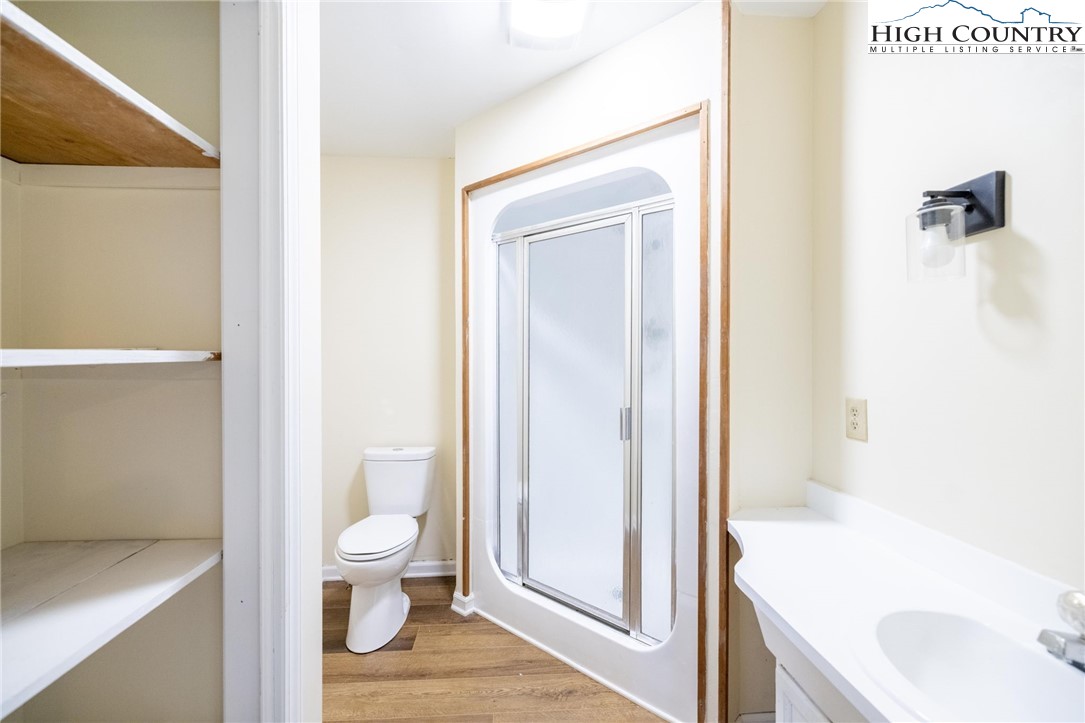 898 3 Top Road Creston, NC 28615 - Photo 34 of 48 a bathroom with a bathtub and a toilet