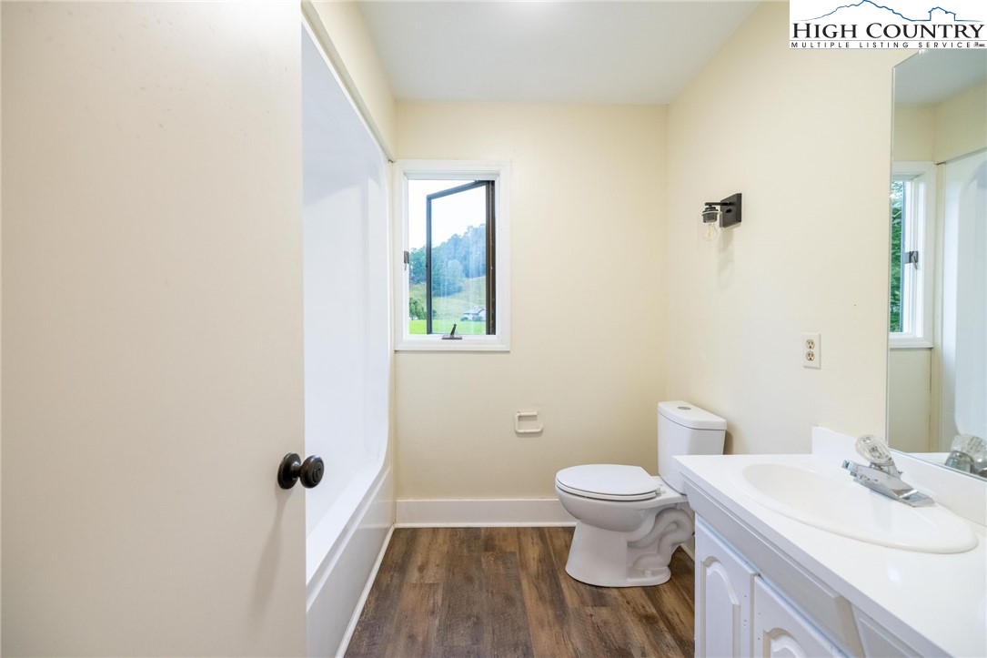 898 3 Top Road Creston, NC 28615 - Photo 36 of 48 a bathroom with a sink a toilet and shower