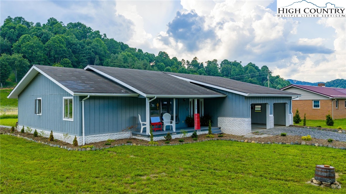 898 3 Top Road Creston, NC 28615 - Photo 41 of 48 a view of a house with a backyard