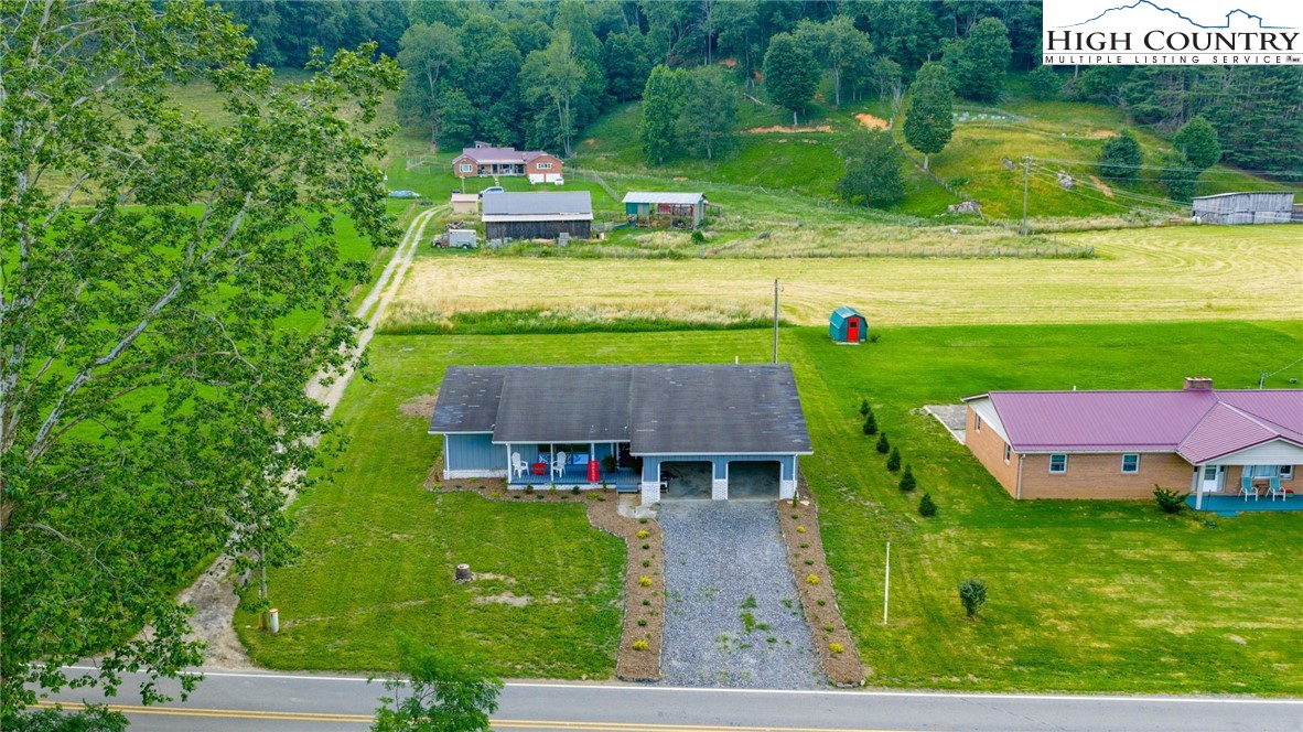 898 3 Top Road Creston, NC 28615 - Photo 42 of 48 a view of a house with a yard