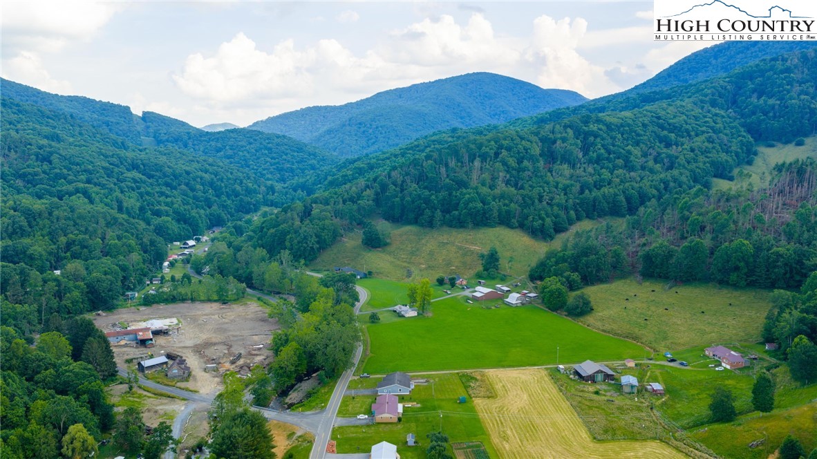 898 3 Top Road Creston, NC 28615 - Photo 45 of 48 a view of a lush green hillside and houses