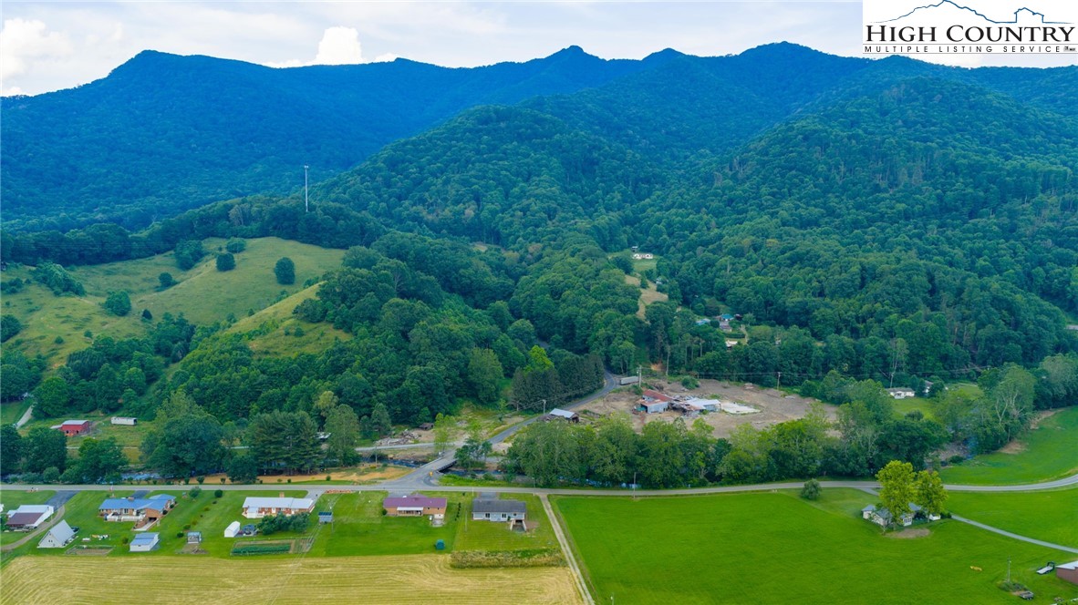 898 3 Top Road Creston, NC 28615 - Photo 46 of 48 a view of a lush green hillside and houses