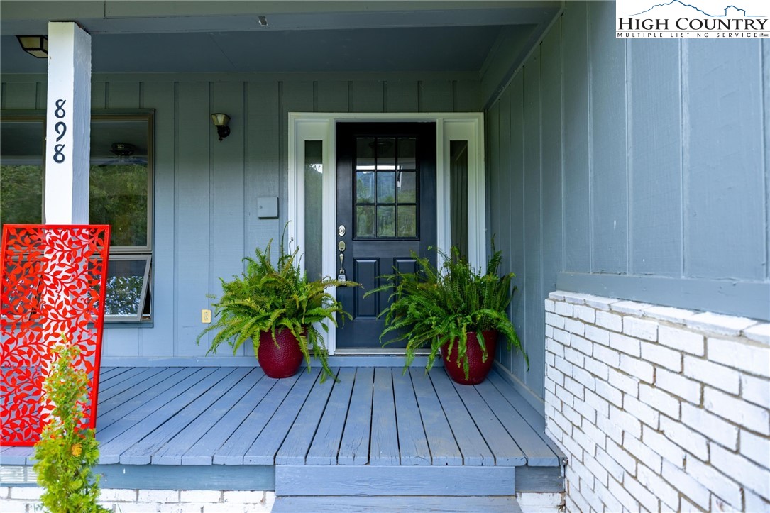 898 3 Top Road Creston, NC 28615 - Photo 5 of 48 a potted plant sitting on a wooden floor