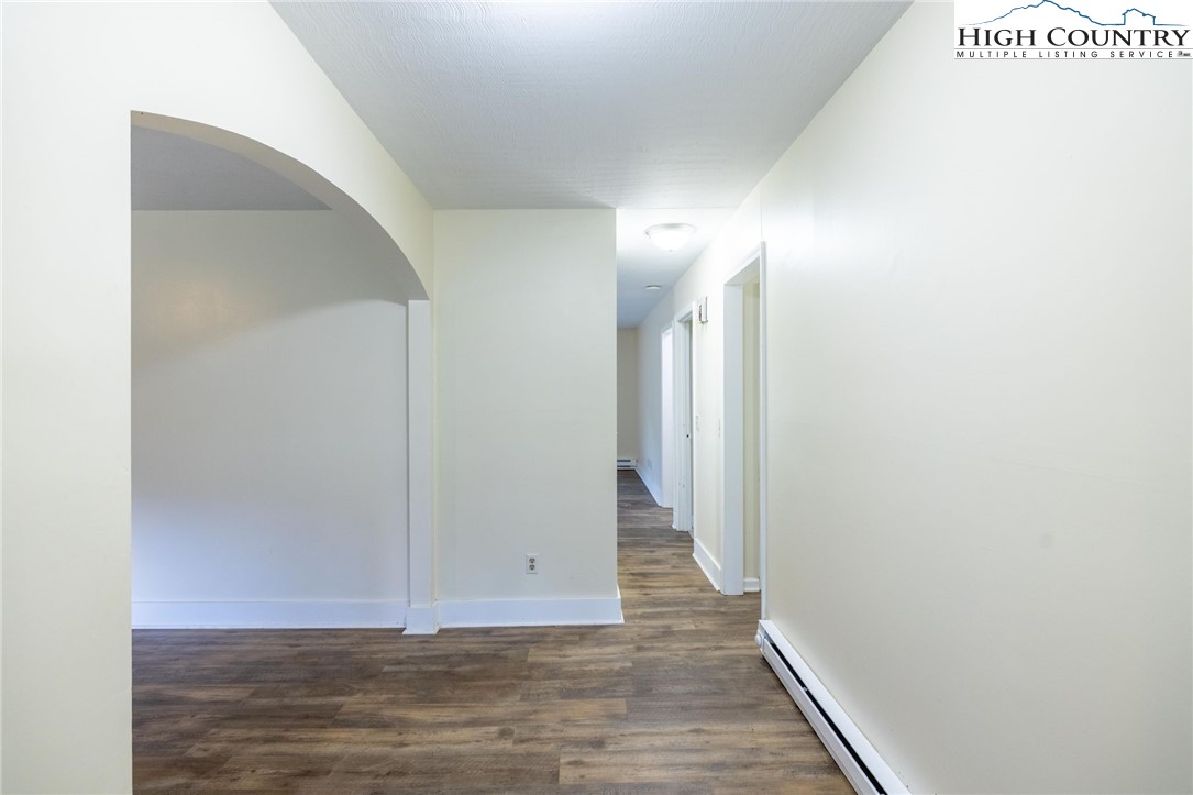 898 3 Top Road Creston, NC 28615 - Photo 8 of 48 a view of a hallway with wooden floor