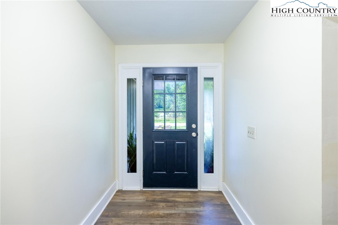 898 3 Top Road Creston, NC 28615 - Photo 9 of 48 a view of a hallway with wooden floor