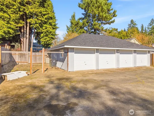 a view of a house with a yard and garage