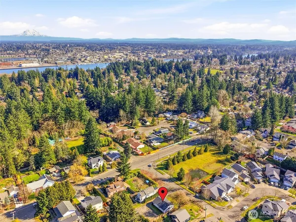 an aerial view of residential houses with outdoor space