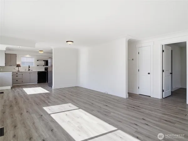 an empty room with wooden floor