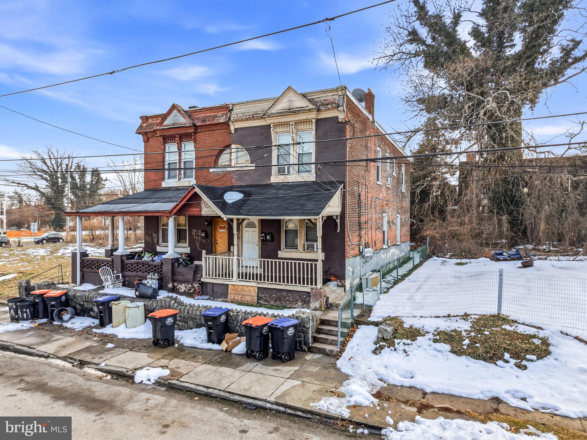 a front view of a house with sitting area