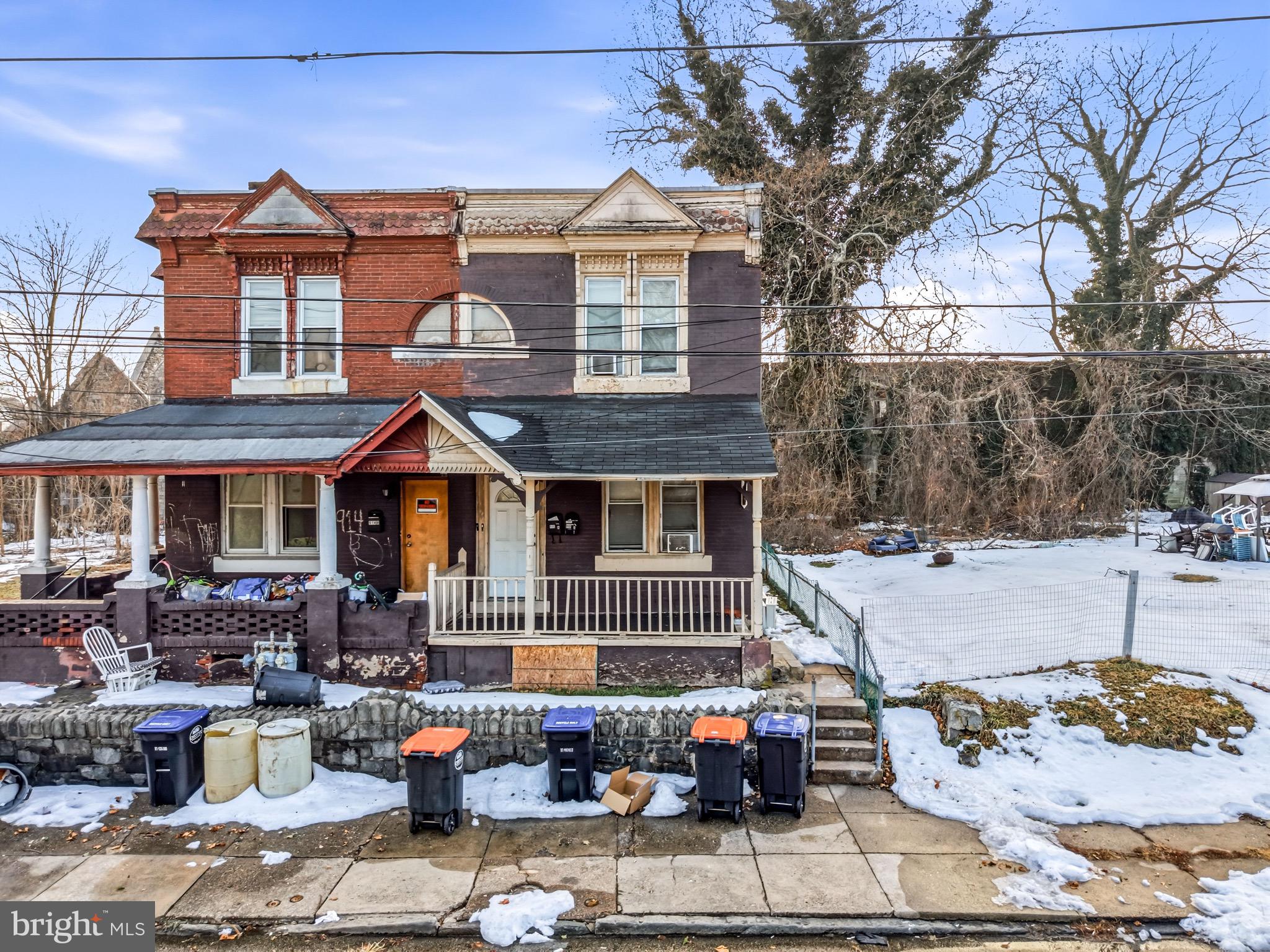 916 Potter Street Chester, PA 19013 - Photo 2 of 3 a front view of a house with cars parked