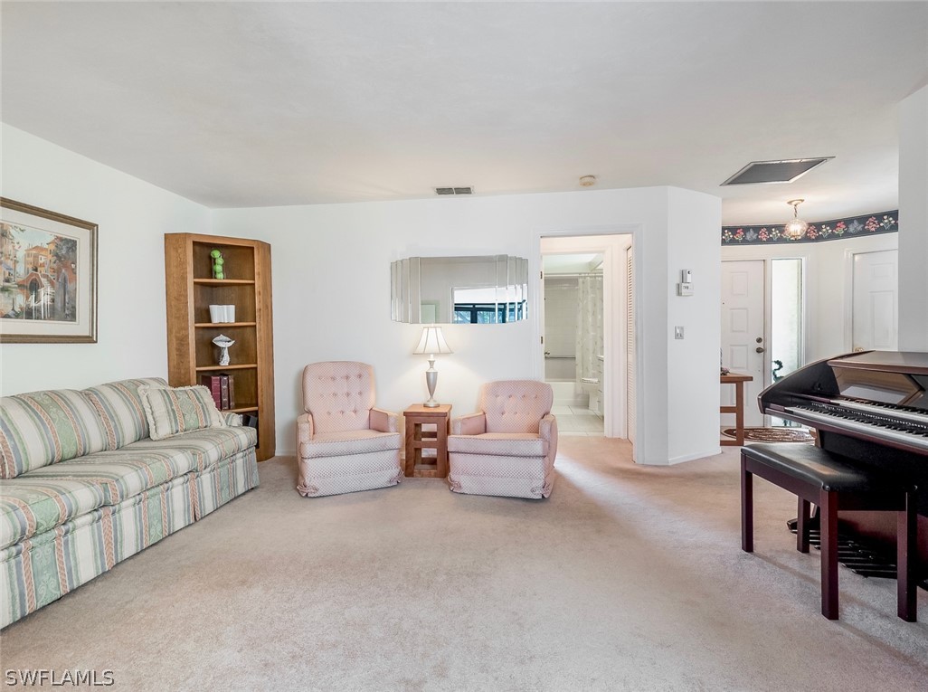 13166 Heather Ridge Loop Fort Myers, FL 33966 - Photo 16 of 31 a living room with furniture and a couch