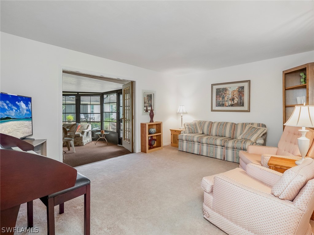 13166 Heather Ridge Loop Fort Myers, FL 33966 - Photo 18 of 31 a living room with furniture and a large window