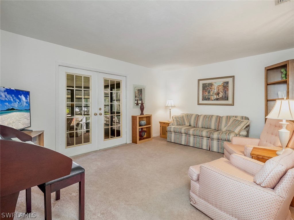 13166 Heather Ridge Loop Fort Myers, FL 33966 - Photo 19 of 31 a living room with furniture and large window