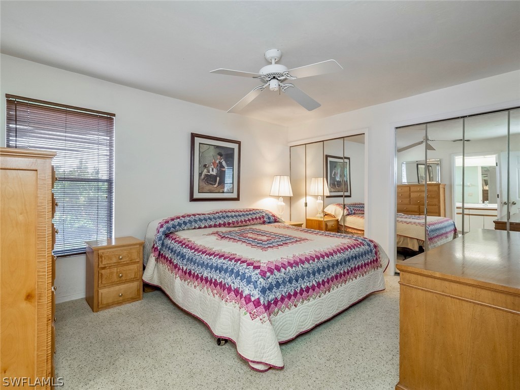 13166 Heather Ridge Loop Fort Myers, FL 33966 - Photo 20 of 31 a bedroom with a bed and window