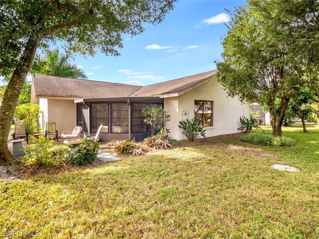 13166 Heather Ridge Loop Fort Myers, FL 33966 - Photo 3 of 31 a view of a house with backyard