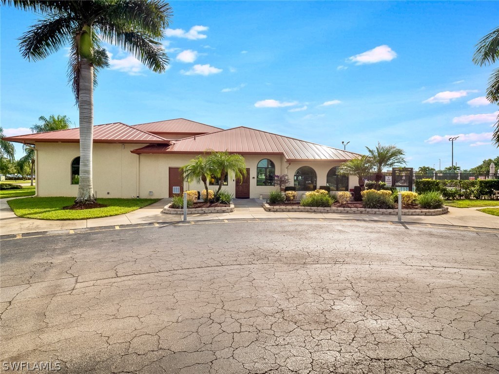 13166 Heather Ridge Loop Fort Myers, FL 33966 - Photo 31 of 31 a house with palm tree in front of it