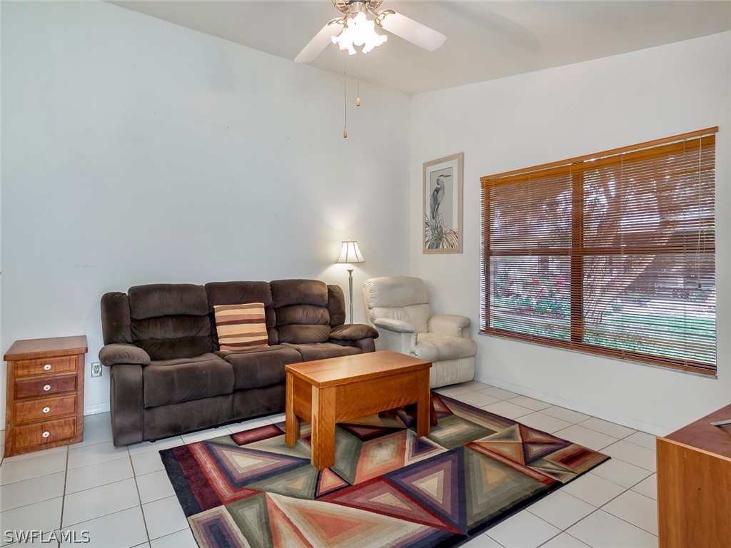 13166 Heather Ridge Loop Fort Myers, FL 33966 - Photo 5 of 31 a living room with furniture and a window