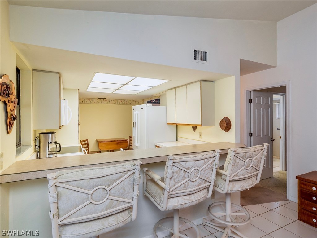 13166 Heather Ridge Loop Fort Myers, FL 33966 - Photo 6 of 31 a spacious bathroom with a sink a mirror and a bathtub