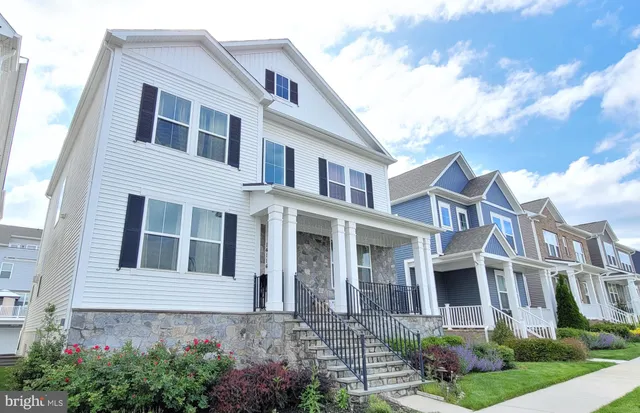 a view of a brick building next to a yard