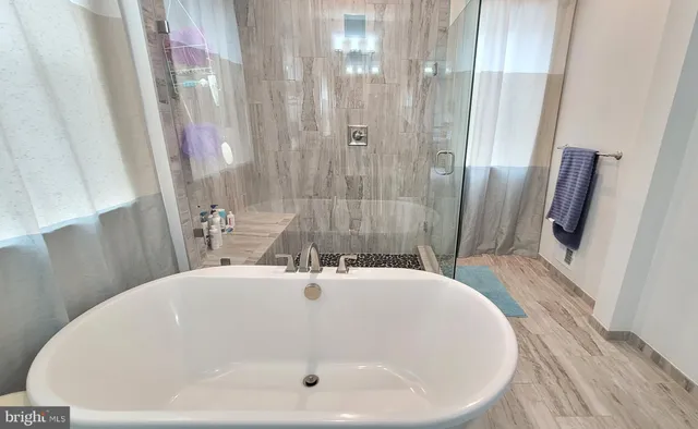 a bathroom with a sink and a large mirror