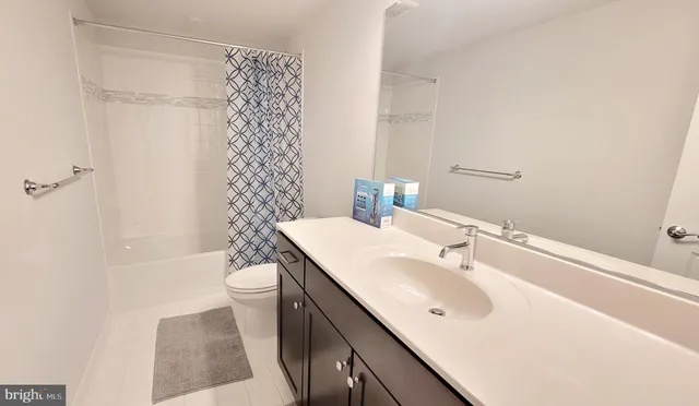 a spacious bedroom with a bed and a window