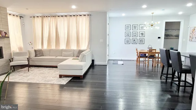 a work room with furniture and a large window